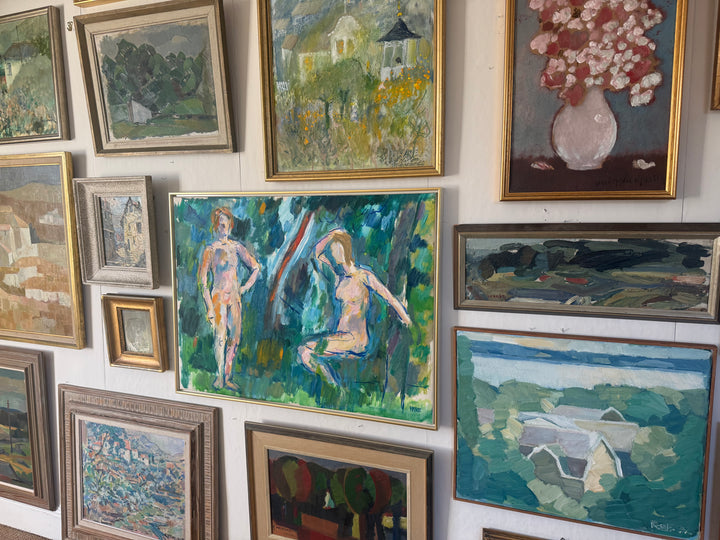Gallery wall with various framed paintings and artworks all vintage one of a kind art
