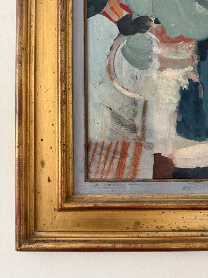 Close-up of a framed painting showing part of an abstract composition with a distressed gold frame against a light wall.